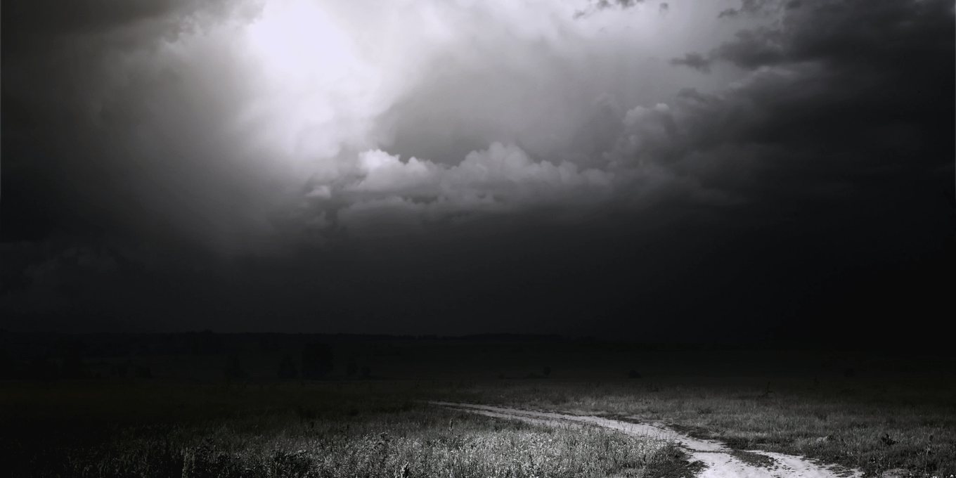 A storm front closing over open country